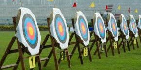 archery targets aligned on grass for outdoor team building activity