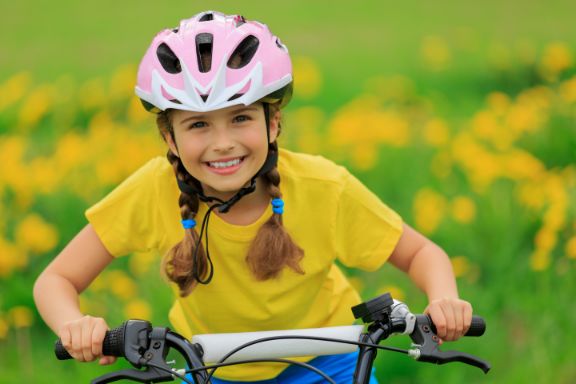Young girl riding her bike