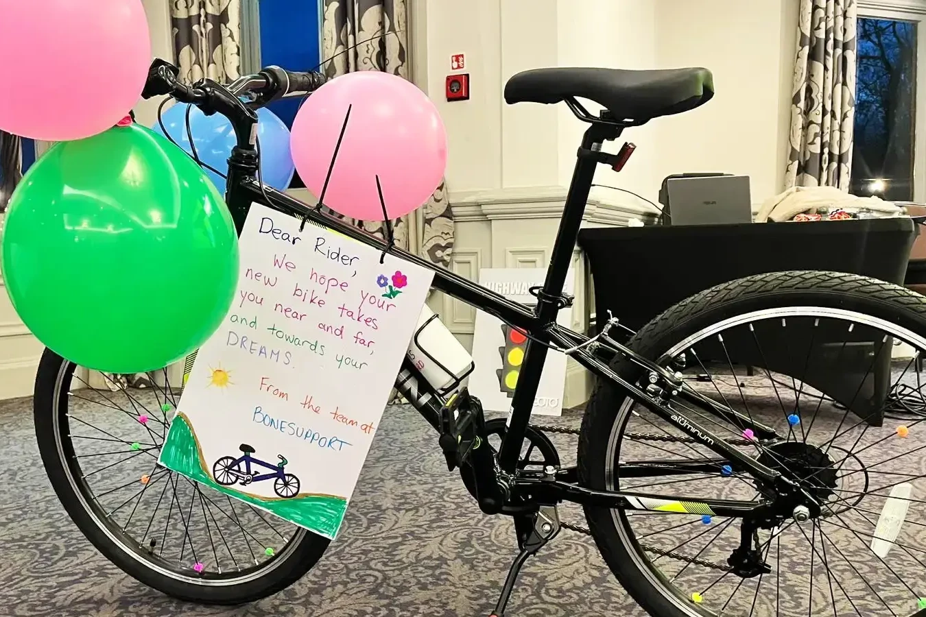 Assembled bike with personalized message after charity bike build team building