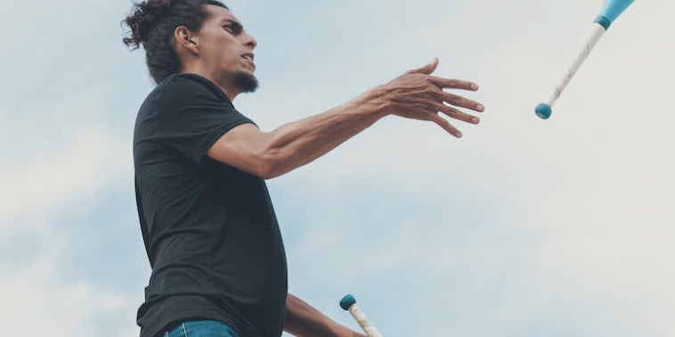 man juggling at circus themed team building event