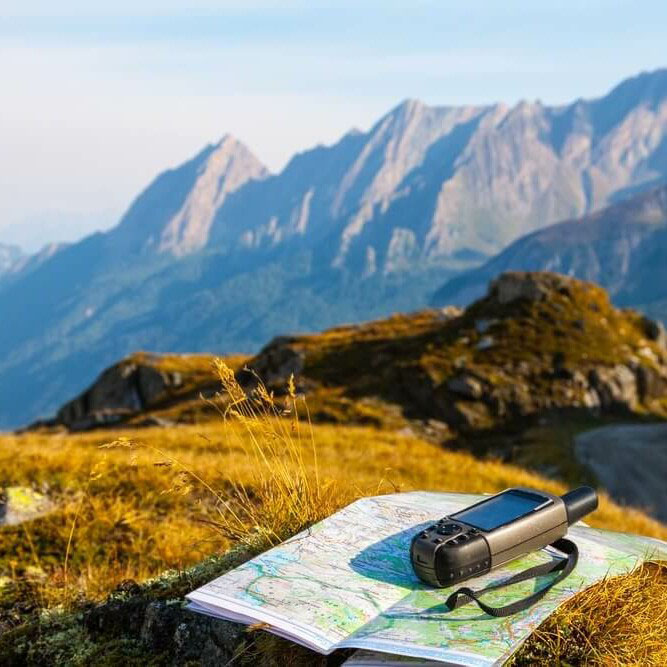 A map a walkie talking places on a rock in mountain scenery