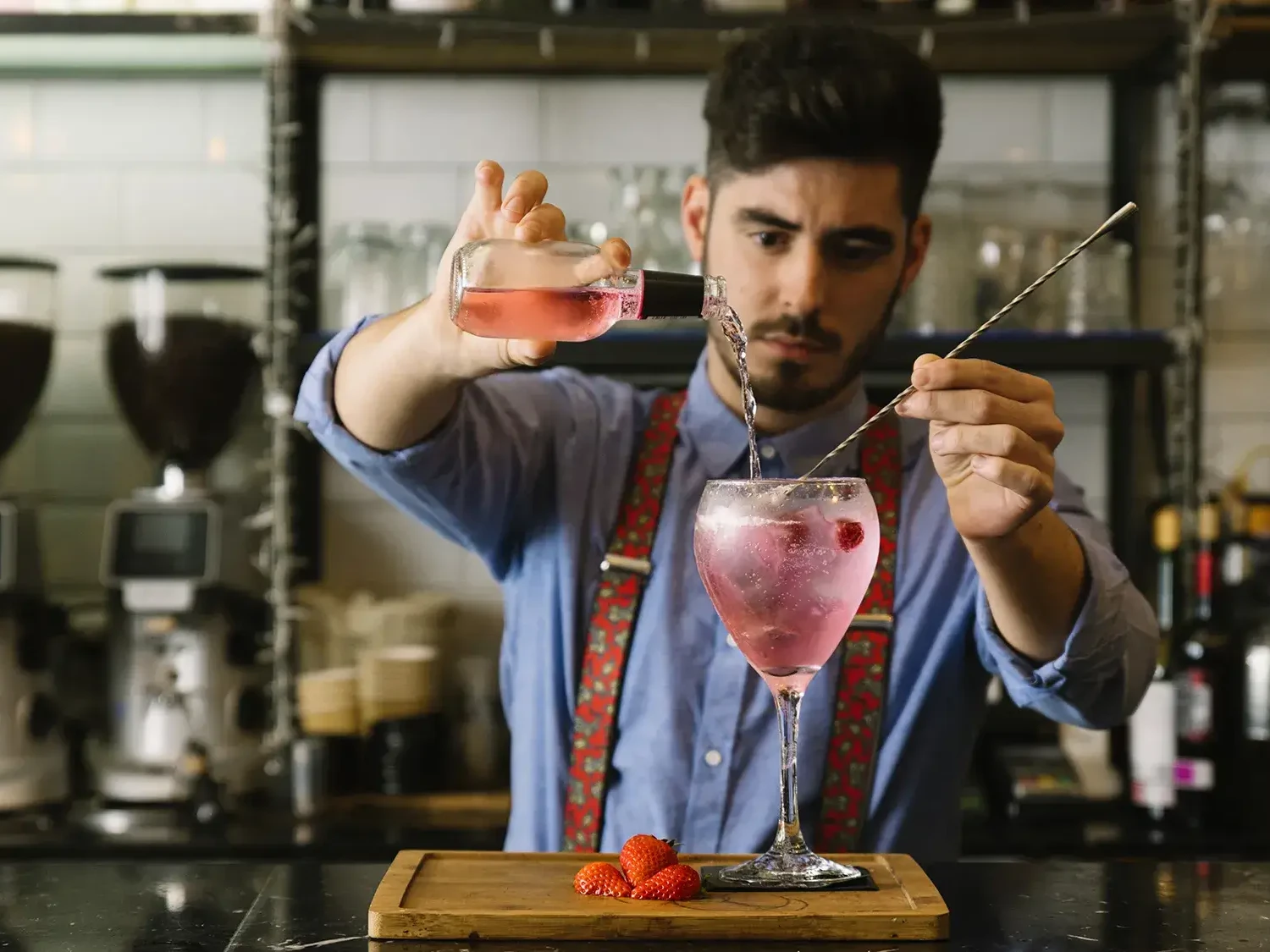 Man mixing a Gin cocktail in Gin Masterclass team activity