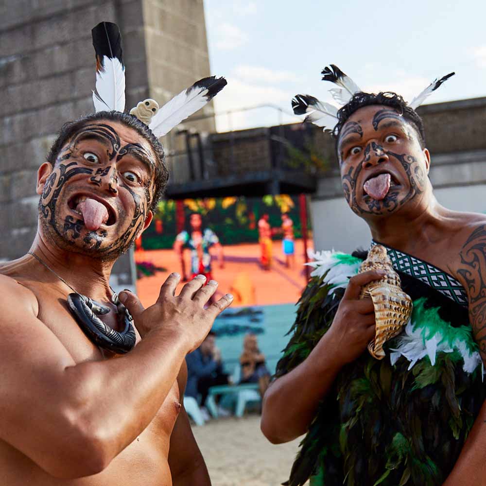 Two Maori men posing during a Haka