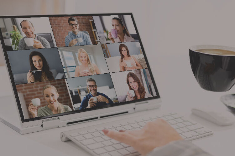 Employee sat at their tablet during a call on a virtual event