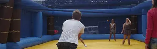 People playing giant inflatable badminton for Olympic-inspired team building event