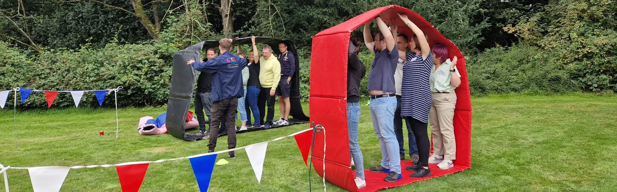 Teams competing in outdoor sports day in Olympic-inspired team building