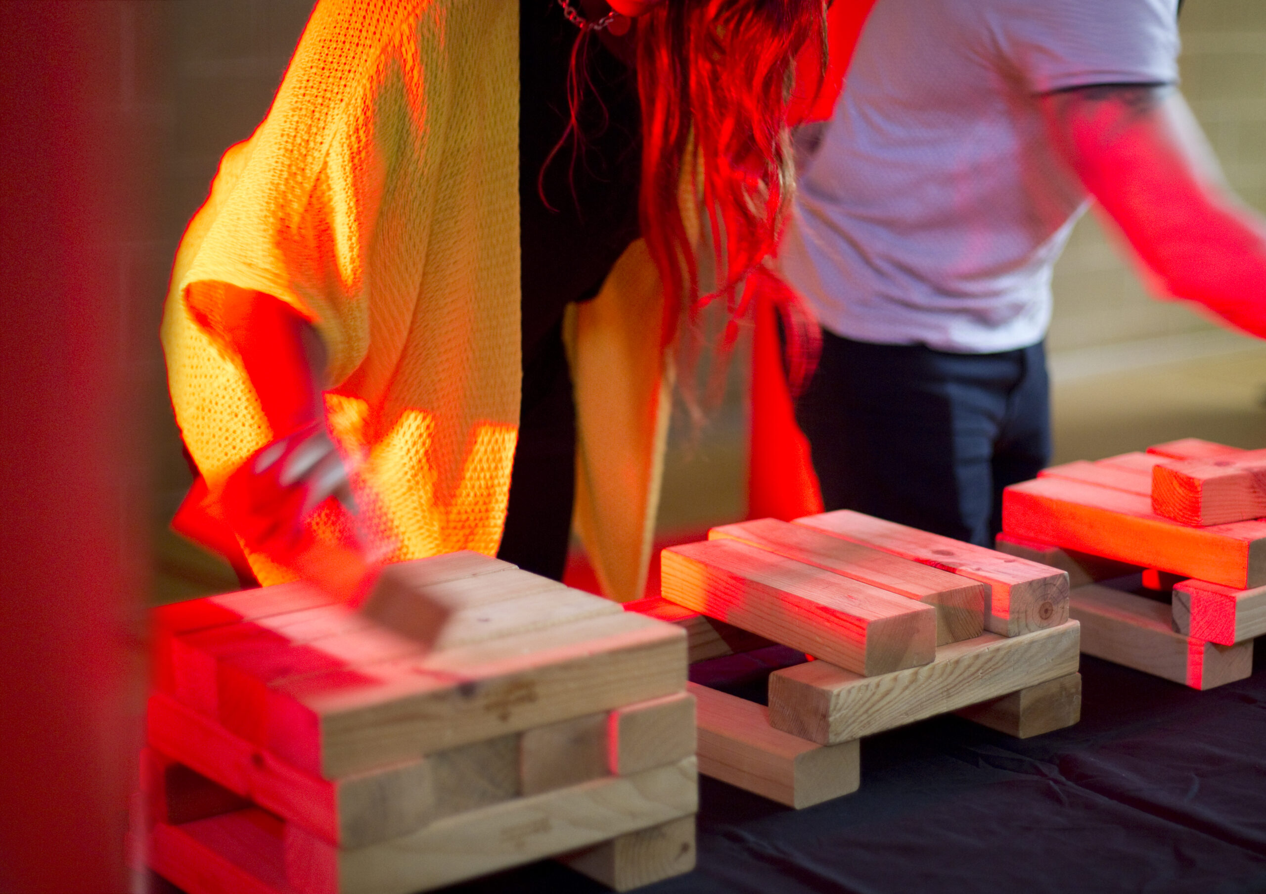 A team stacking blocks during an Under Pressure team building game