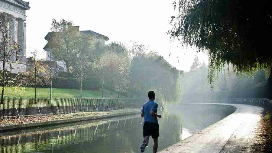 Man running along canal