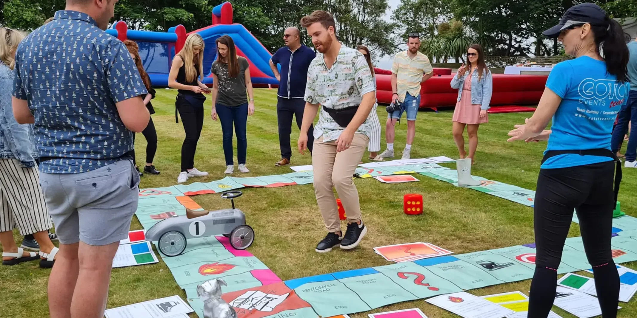 Teamopoly indoor team building activity giant monopoly on grass