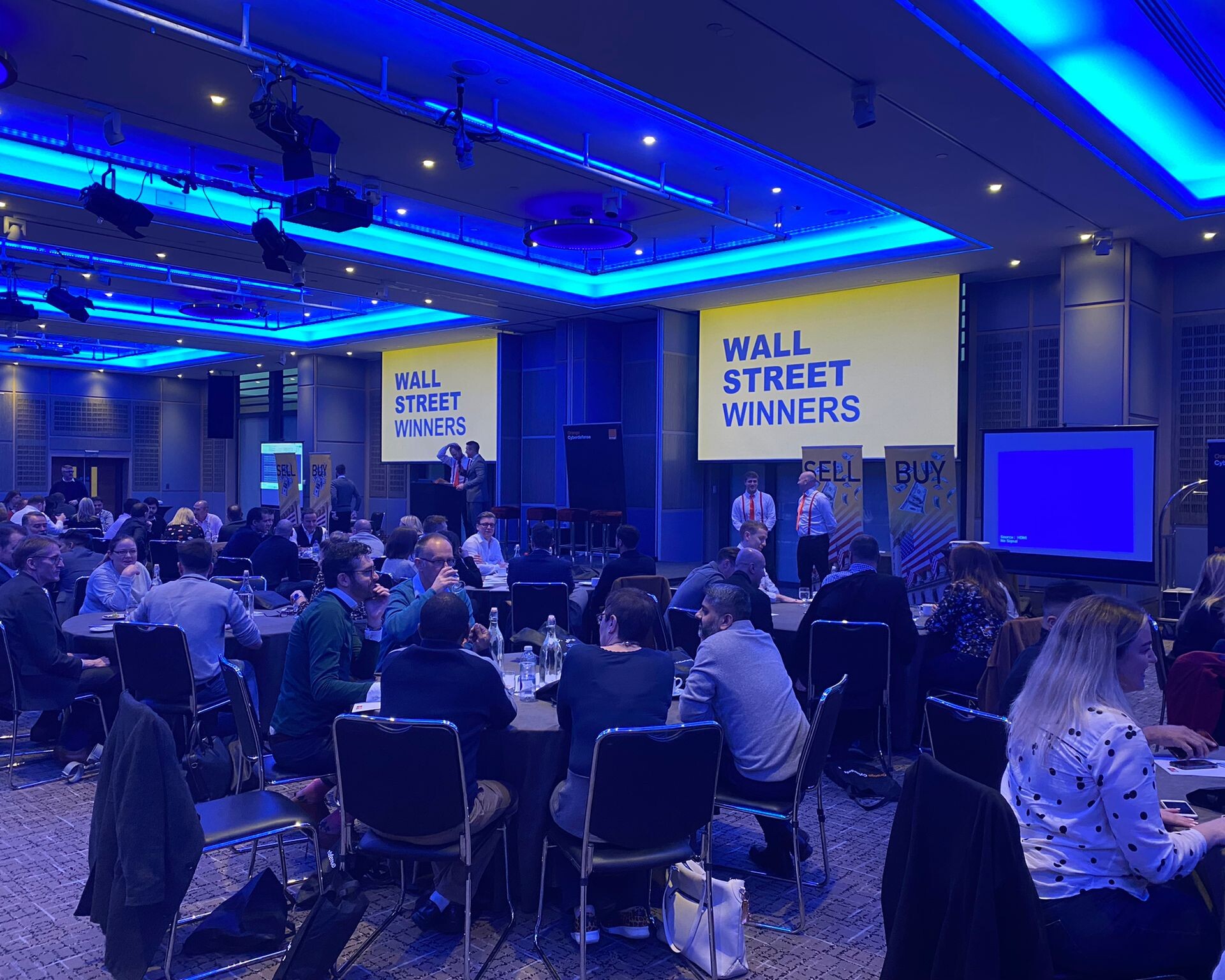 Large room of team building participants