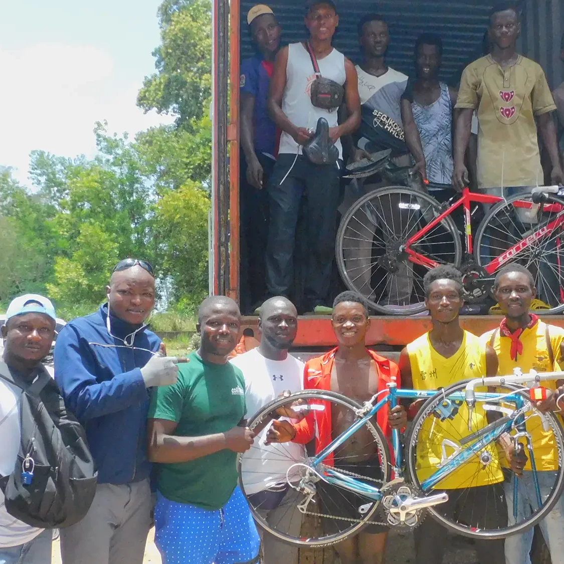 People in Africa receiving bikes from Re Cycle