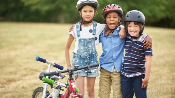3 Children by their bikes
