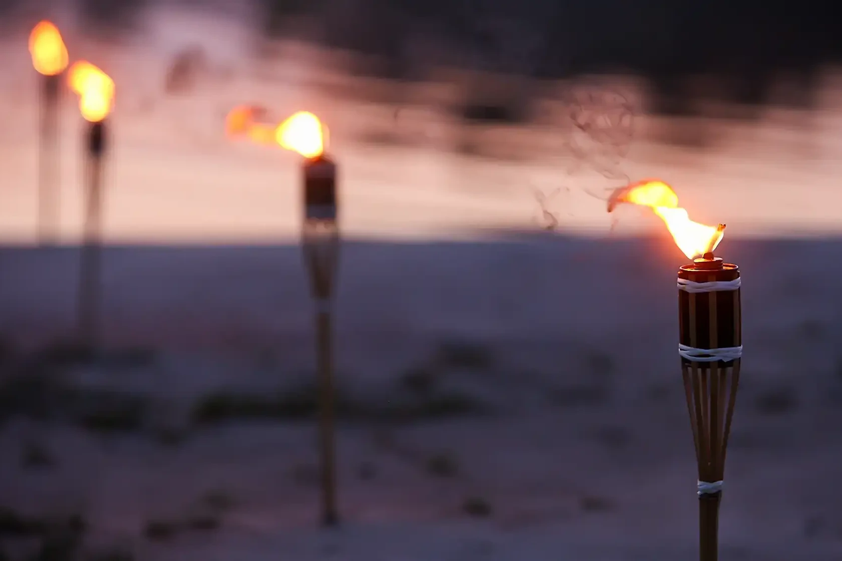 survivor torch on beach during survival team building
